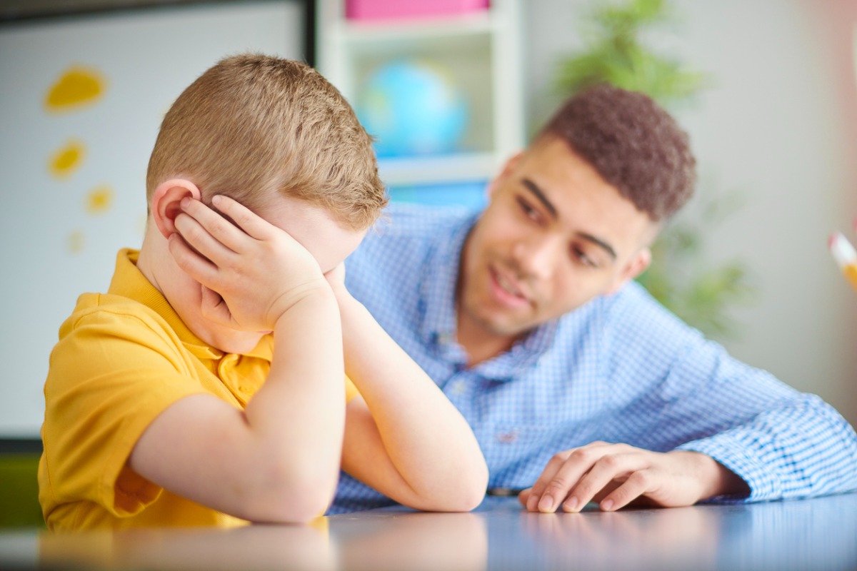 Image of boy and therapist working